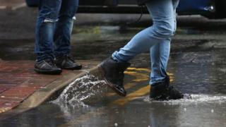 Stepping into puddle off kerb