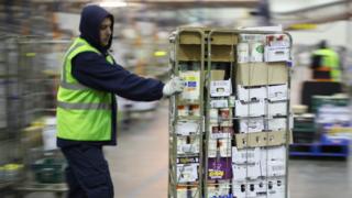 A worker in a Sainsbury's warehouse