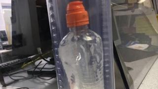 Metropolitan Police undated handout photo of the bottle containing a bleach-like substance that was being carried by Bradley Kerr when he was arrested in Bow Road station in east London