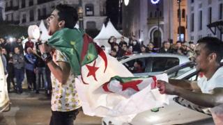 Protesters march through the streets of Algiers