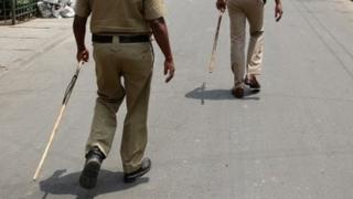 Police with sticks. File photo