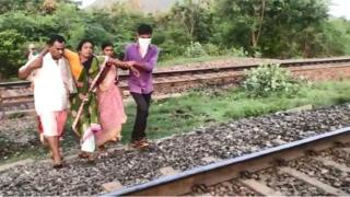 Woman on railway tracks