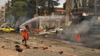 Fire outside al-Dabbeet hospital after rockets reportedly fired by rebels hit government-controlled area of Muhafaza in Aleppo on May 3, 2016.