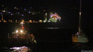 Douglas lifeboat Sir William Hillary with casualty vessel in Douglas harbour