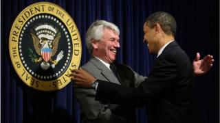 U.S. President Barack Obama (R) greets White House counsel Gregory Craig (L) during an event at the Eisenhower Executive Office Building of the White House January 21, 2009 in Washington.