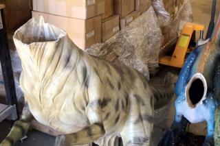 This handout from the Australian Capital Territory Policing taken on 7 August 2017 and released 8 August 2017 shows models of headless raptors at Australia's national dinosaur museum. Three model raptors at Australia's national dinosaur museum have been beheaded by mystery vandals who scaled a fence and removed the parts using an angle grinder or hacksaw, police said on 8 August.