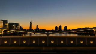 The sun setting over London from the Albert Bridge