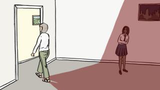 Elizabeth walks out of a room, casting a shadow over her daughter Grace