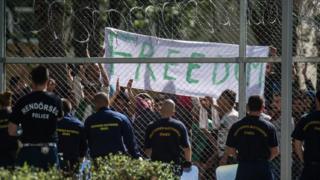 Migrants chant the slogan "Freedom" as they protest demanding better conditions and faster administrative process deciding about their asylum claim