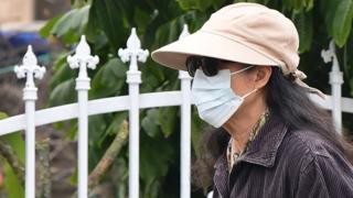 A woman wears a face mask in Monterey Park, California