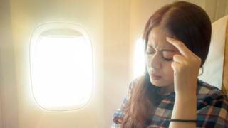 žena u avionu