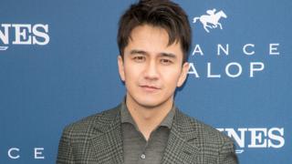 Actor Zhai Tianlin attends the Prix de Diane Longines 2018 at Hippodrome de Chantilly on June 17, 2018 in Chantilly, France