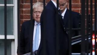 Prime Minister Boris Johnson leaves from the rear of 10 Downing Street