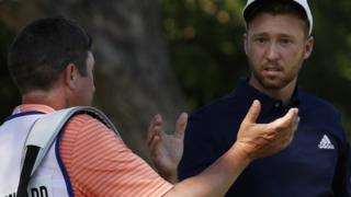 Daniel Berger celebrates victory with his caddie