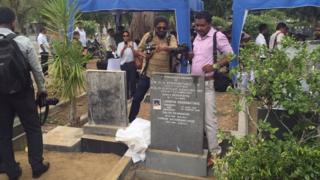 The press were allowed to photograph the grave after the body was removed