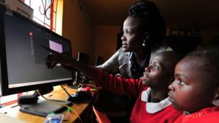 Kenyan pupils learning how to use a computer