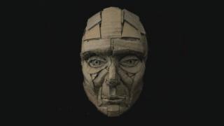 Cardboard face sculpture