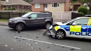 Crash between police car and other vehicle