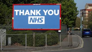 A billboard displaying a message in support of the NHS