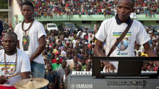 The band Nouvelles Écritures (Emmanuel Ngallos on keyboards) performing at a stadium in Bangui, CAR in March 2018