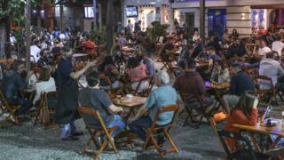 Customers enjoy a bar in Tijuca neighbourhood on the second day after the opening of bars and restaurants