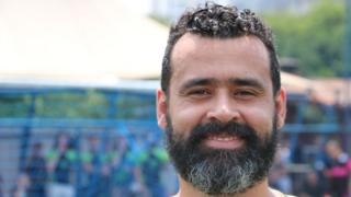 Douglas Braga poses for the camera at a LGBT football tournament