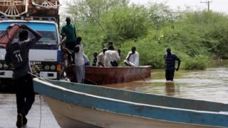 People load items they salvaged from their village onto trucks following heaving floods in Wad Ramli, some 45 km north of Khartoum, Sudan, 25 August 2019