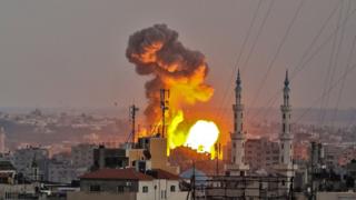 A picture taken on July 20, 2018 shows a fireball exploding in Gaza City during Israeli bombardment. Israeli aircraft and tanks hit targets throughout the Gaza Strip on July 20