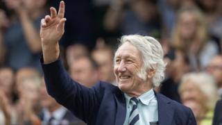 JPR Williams acknowledges the crowd at Wimbledon in July 2023