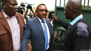 Pastor James Ng'ang'a of Neno Evangelism Center is escorted by police officers to the courtroom shortly before his hearing in Limuru, Kenya - 20 August 2015.