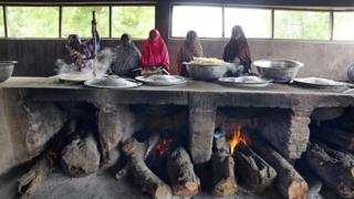 Women cook in the kitchen in Yerwa girls school in Maiduguri, Nigeria July 18, 2017.