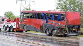 Damaged OGA Charters bus hauled away after fatal rollover in Texas on Saturday, May 14, 2016,