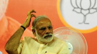 Indian Prime Minister Narendra Modi gestures as he prepares to address an election rally of Bharatiya Janata Party(BJP)supporters at The YMCA Grounds in Chennai on May 6, 2016, ahead of voting in state assembly elections in the southern Indian state of Tamil Nadu