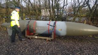 Police look at the fuel tank