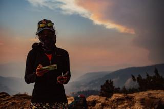 in_pictures Hiker in Sierra National forest amid a wildfire