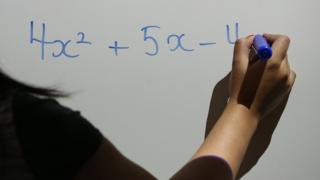 Teacher using interactive whiteboard marker