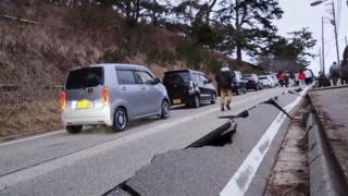 Road cracks caused by an earthquake are seen in Wajima, Ishikawa prefecture, Japan, 1 January 1, 2024, in this photo released by Kyodo.