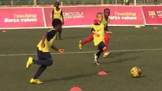 Group of children playing football at the Barcelona Lagos Academy inside the Teslim Balogun Stadium Complex in Surulere.