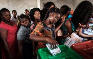 A woman casts her ballot as she votes in the presidential and parliamentary elections on February 23, 2019, at a polling station in Port Harcourt, southern Nigeria