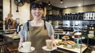 A waitress carrying coffee