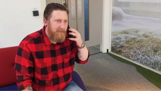 Scott Forsyth talking on his phone at BBC Newcastle