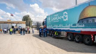 A truck of humanitarian aid for Gaza is parked outside the Rafah crossing