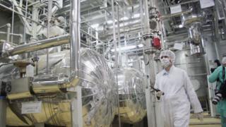 A worker walks inside of an uranium conversion facility March 30, 2005 just outside the city of Isfahan, about 254 miles (410 kilometers), south of capital Tehran, Iran.