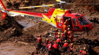 Rescuers search for victims at the site of the disaster - 28 January