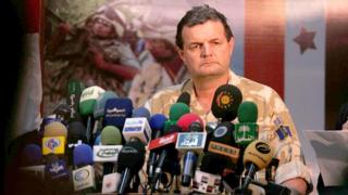 Maj Gen Graham Binns prepares to sign a memorandum of understanding at a press conference in Basra airport as the security control for the southern province of Basra was formally handed back to the Iraqis.