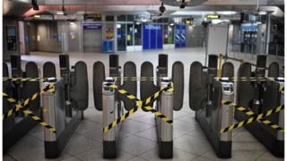 Alternate ticket turnstiles are cordoned off to make commuters observe social distancing measures as a precautionary measure against COVID-19, at Westminster underground station