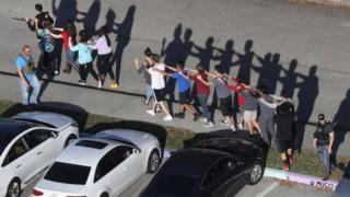 Dem carry people dey come out after di shooting.
