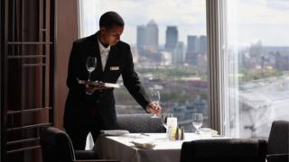A waiter lays in the Shangri-La Hotel at the Shard