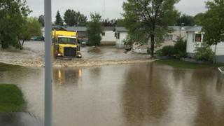 Emergency crews worked to drain flood waters after heavy rains in Fort McMurray in the Canadian province of Alberta.