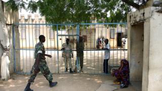 Chadian police at the gates of a prison in the capital N'Djamena